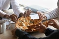 Close up of diverse employees eating tasty pizza in office Royalty Free Stock Photo