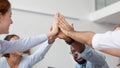 Close up diverse employees team giving high five at company meeting Royalty Free Stock Photo