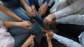 Close up of diverse people hold hands engaged in training Royalty Free Stock Photo