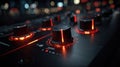 Close-up of a DJ mixer with illuminated knobs and controls Royalty Free Stock Photo