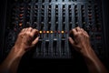 Close up of a dj\'s hands adjusting the volume on a sound mixer, Hand on a sound mixer station, top view, AI Generated