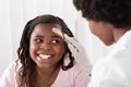 Doctor Applying Band Aid To Girl Head Royalty Free Stock Photo