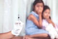 Close up doctor hand holding syringe with a child girl fear Royalty Free Stock Photo