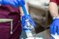 Close-up of doctor hands in protective gloves filling the syringe with medicine. Hands of doctor gaining in syringe medication Royalty Free Stock Photo