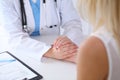 Close up of doctor hands reassuring her female patient Royalty Free Stock Photo