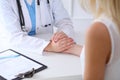 Close up of doctor hands reassuring her female patient Royalty Free Stock Photo