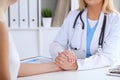 Close up of doctor hands reassuring her female patient Royalty Free Stock Photo