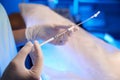 Close up of doctor hands using syringe for artificial fertilization