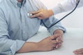 Close up of doctor listening to patient heartbeat with stethoscope on hospital, Physical examination, Medical and health care con