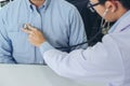 Close up of doctor listening to patient heartbeat with stethoscope on hospital, Physical examination, Medical and health care con