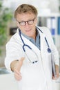 Close up doctor man shaking hands with patient Royalty Free Stock Photo