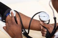 Doctor Measuring Blood Pressure Of Patient Royalty Free Stock Photo