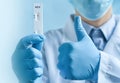 doctor's hands in medical gloves holding negative self testing hepatitis C virus (HCV) test