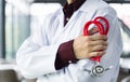 Close up doctor stood and Crossed Arms with a stethoscope at the hospital. He looked at the camera with copy space and blur back Royalty Free Stock Photo