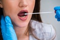 Close-up Of A Doctor Taking Saliva Sample For DNA Test Royalty Free Stock Photo