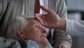 Close up of doctor visiting sick elderly man and his wife at home Royalty Free Stock Photo