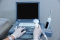 Close up of doctors hand on ultrasonography apparatus