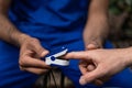 Close up of doctors hands measuring patients pulse with pulsometer