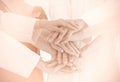 Close up doctors and nurses in a medical team stacking hands tea