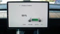 CLOSE UP: Touchpad on dashboard shows a notification of the battery being full.