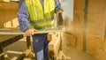 CLOSE UP, DOF: Unrecognizable builder cuts a gypsum wall board with a jigsaw.