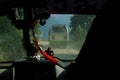 CLOSE UP, DOF: View through the windshield of a jeep while driving behind a bus.
