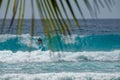 CLOSE UP: Young female tourist on vacation in Barbados surfs a big barrel wave. Royalty Free Stock Photo