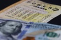 Close up of 100 Dollar Bill, and lottery ticket for Powerball in Georgia, USA.