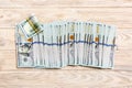 Close up of 100 dollar bills in a row on colorful background. Top view of salary concept Royalty Free Stock Photo