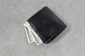 Close up of dollar money in black wallet on table Royalty Free Stock Photo