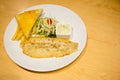 Close up dolly fish grilled steak , garlic bread, salad and lemon white sauce in set. Royalty Free Stock Photo