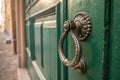 A close up of a door handle on a green door. AI generative image