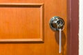 Close-up of a door handle with a key entrance Royalty Free Stock Photo