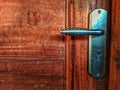 close up door handle and wooden door Royalty Free Stock Photo