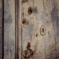Close up of a door with three ancient locks and an old knocker Royalty Free Stock Photo