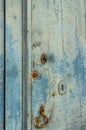 Close up of a door with three ancient locks and an old knocker Royalty Free Stock Photo