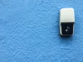 Close-up Doorbell Button with blue background