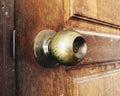 Close up of doorknob on wooden door