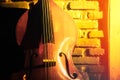 Close-up of double bass on a brick wall background in a club basement, underground jazz music
