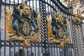 London, England. Buckingham Palace gates with Coats of Arms close up Royalty Free Stock Photo