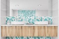 Close up of double sink in blue mosaic bathroom Royalty Free Stock Photo
