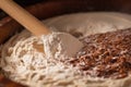 close-up of dough being mixed with wooden spoon