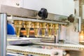 Close up dough or cream and nozzle discharge of automatic biscuit or sweets making machine in production line for high technology