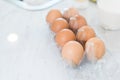 Close up of dozen of eggs on white table for prepare cooking in kitchen. Dessert ingredients and food concept Royalty Free Stock Photo