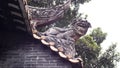 Close up of a dragon lion sculpture decorate on a roof of an old chinese tradition architecture in Shawan ancient town Guangzhou