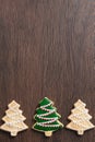 Close up of drawing Christmas tree sugar cookie on wooden table background with icing Royalty Free Stock Photo