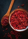 Close-up of dried goji berries in a bowl on dark background Royalty Free Stock Photo