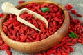 Close up of dried goji berries in wooden bowl. Selective focus Royalty Free Stock Photo