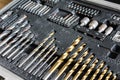 Different lengths of drilling machine bits on wooden background Royalty Free Stock Photo