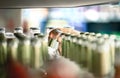 Close up of drink shelf in supermarket. Alcohol, soda, sodapop, mineral water or ginger ale bottle. Customer buying product. Royalty Free Stock Photo